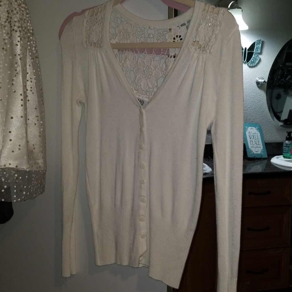 Size L/XL but fits like a small white sweater